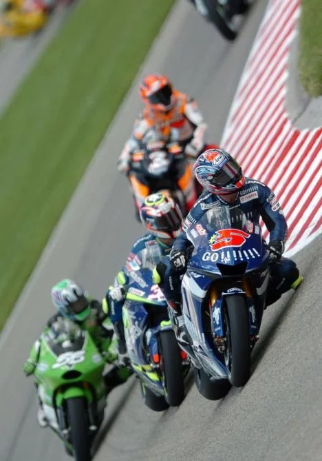 Edwards, Melandri and Nakano lead Biaggi in a fight for the minor placings - Biaggi came through to score fourth place while nakano got sixth, Melandri seventh and Edwards slipped to eighth
