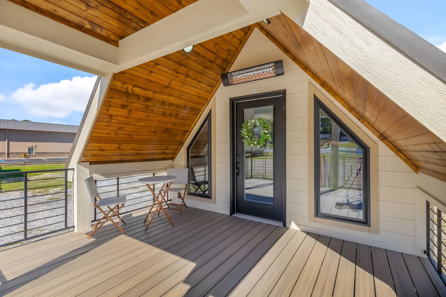 The Tinde's porch area is very spacious and includes seating, along with a heater
