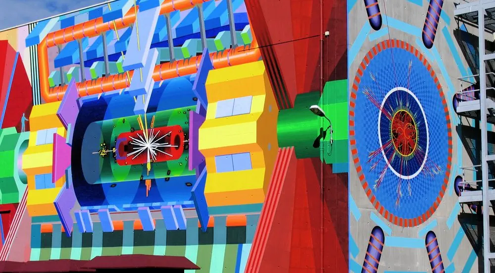 A view that nearly captures the entire CERN ATLAS mural. The person at the very left of the mural gives scale (Photo: J. Kristofoletti)