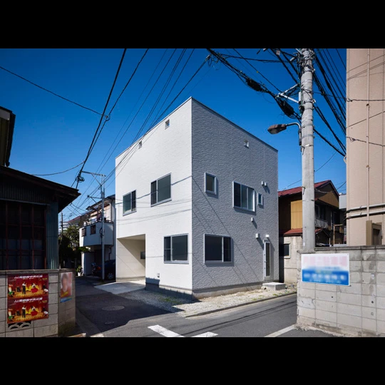 The modern home stretches over three levels and features a rooftop deck surrounded by a two-meter (6.5-foot) parapet