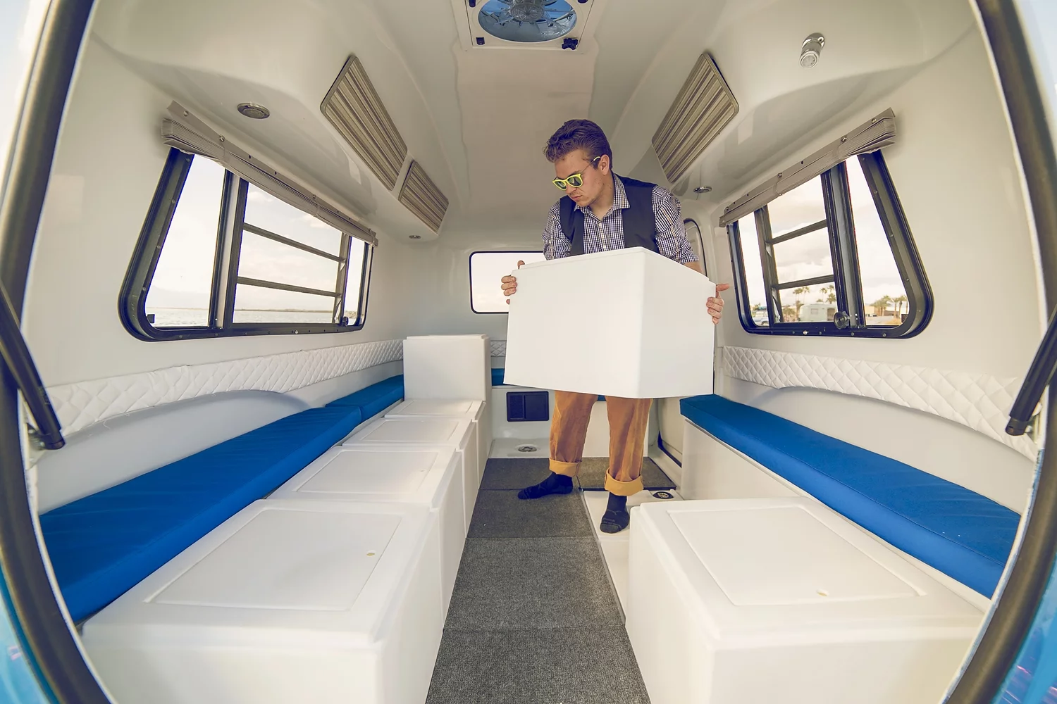 The Happier Camper HC1 travel trailer has six base furniture components that can be moved slotted into place