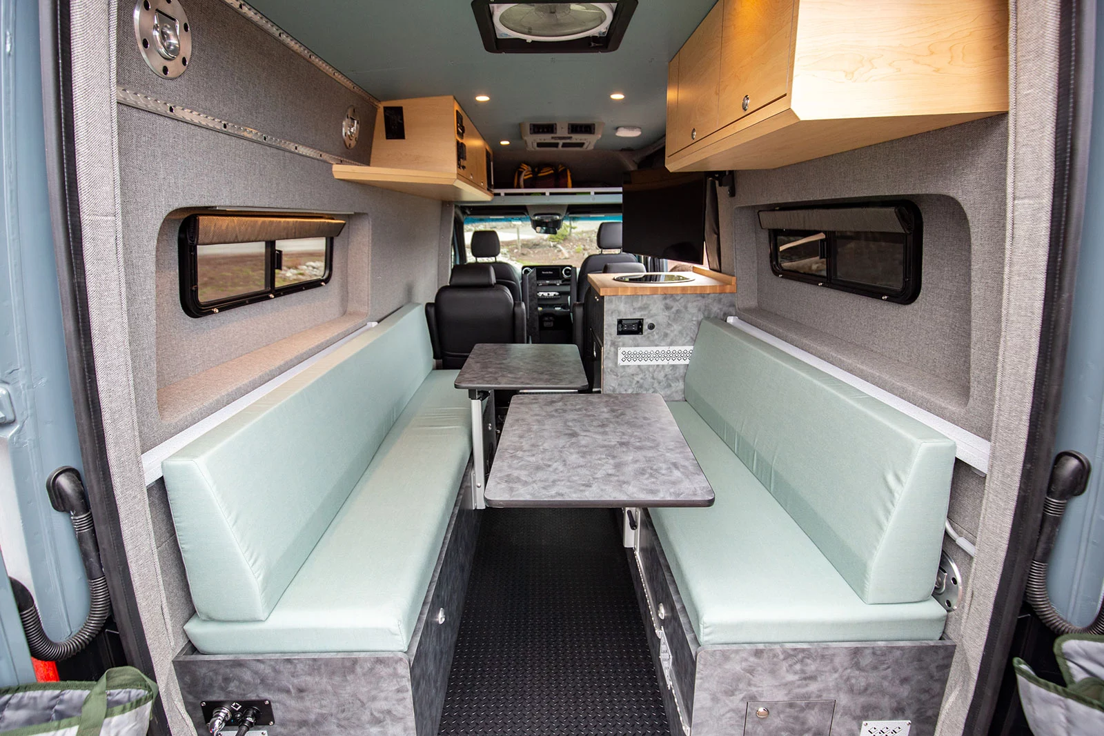 The dual Lagun tables provide plenty of flexible eating and work space before converting into the center panels for the lower bed