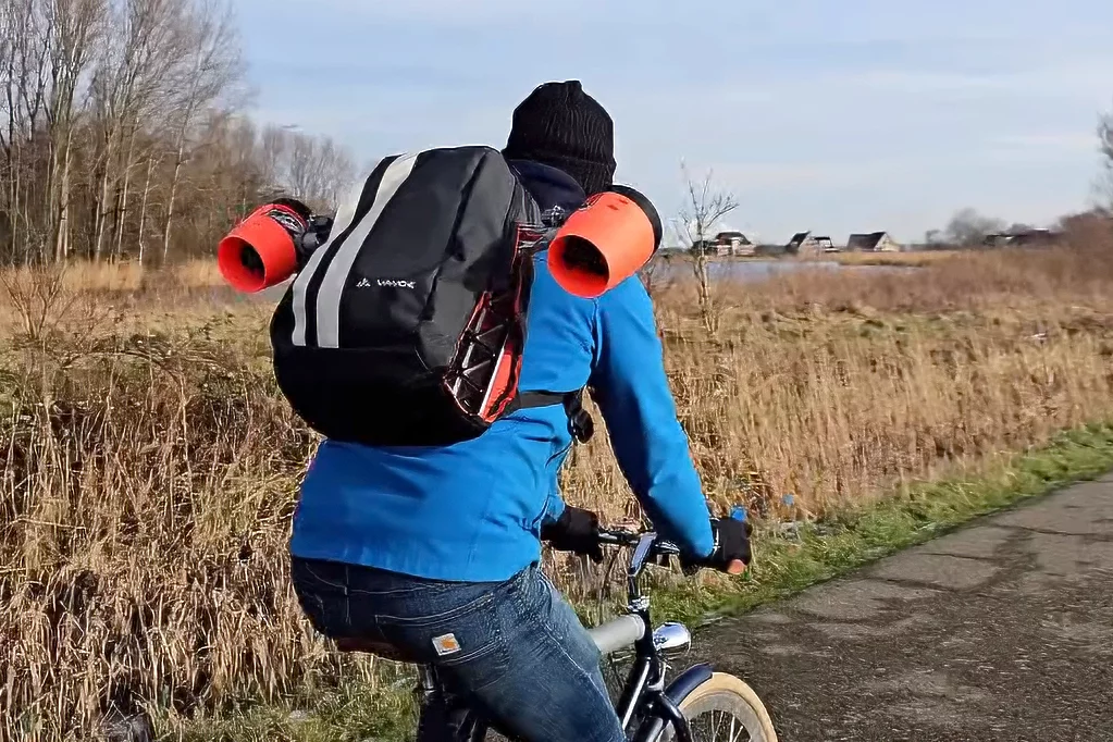 The Practical Engineer addressed this idea with a transforming backpack which pops out two electric ducted fans (EDFs) when he's cycling and wants a boost. This video shows how he did it, though if you don't speak Dutch, try this article from Hackaday.