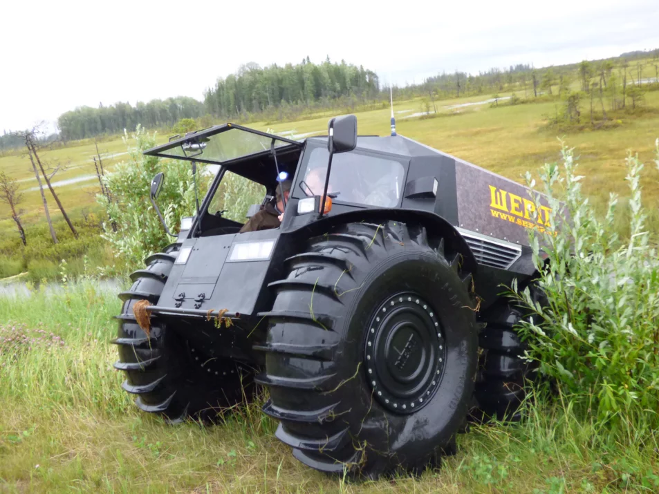 Riding through the field in the Sherp ATV