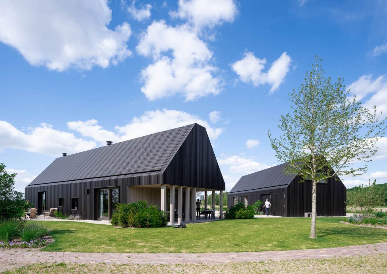 The first barn-house boasts a large adjoining exterior terrace