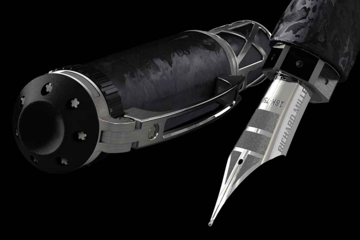 The Richard Mille RMS05 fountain pen uses a precision watch mechanism to extend the white-gold nib