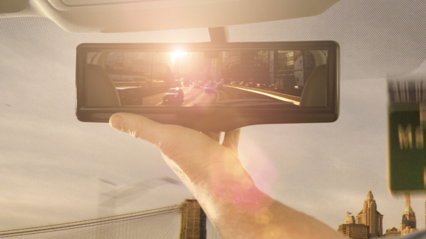Nissan's smart mirror. In conditions where glare is a problem, such as dawn, dusk and with a tailing car with headlights on high beam, the image processing software can provide a clearer picture by modifying the image.