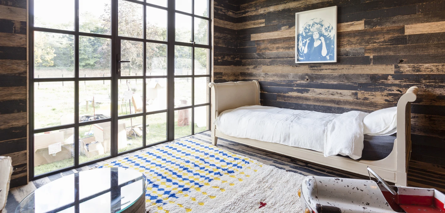 Reclaimed timber was used for for the flooring; double glazed aluminum doors and toughened glass windows