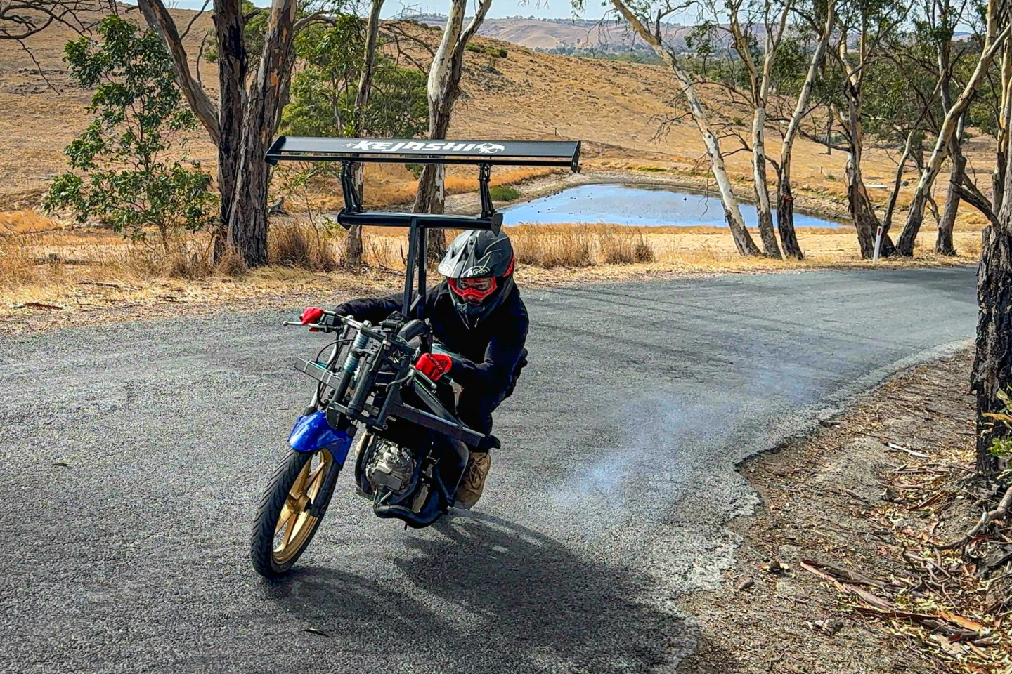 Kent Shillitoe corners on the tilt-wing Kejashi motorcycle