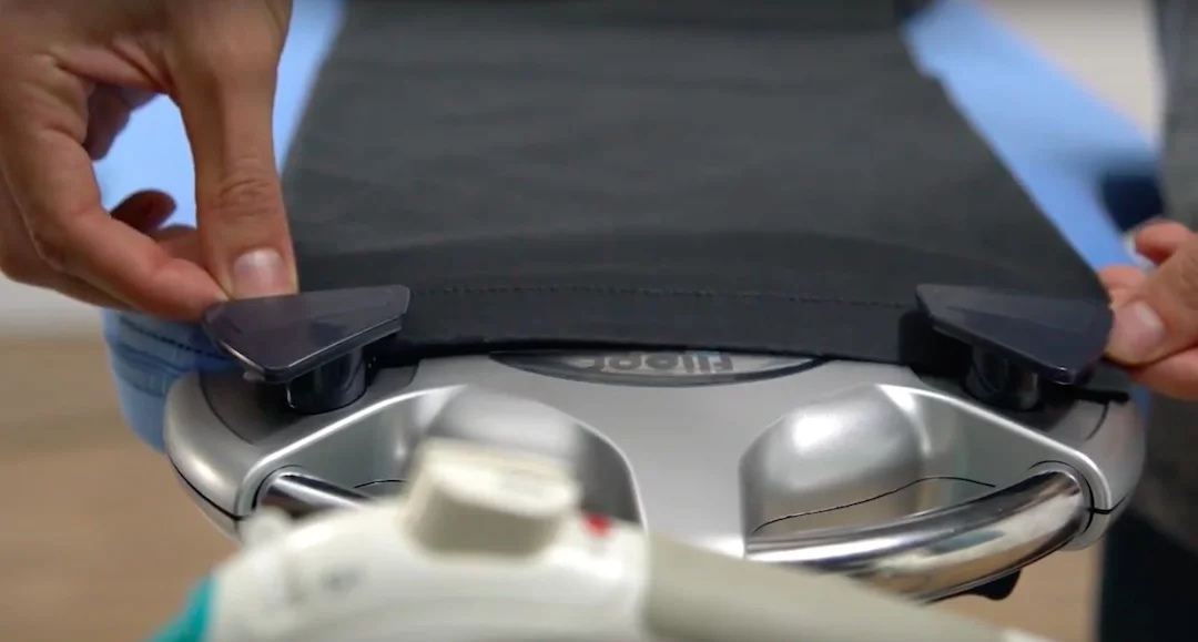 Flippr includes a pair of pants clips to hold pants in place while they're being ironed