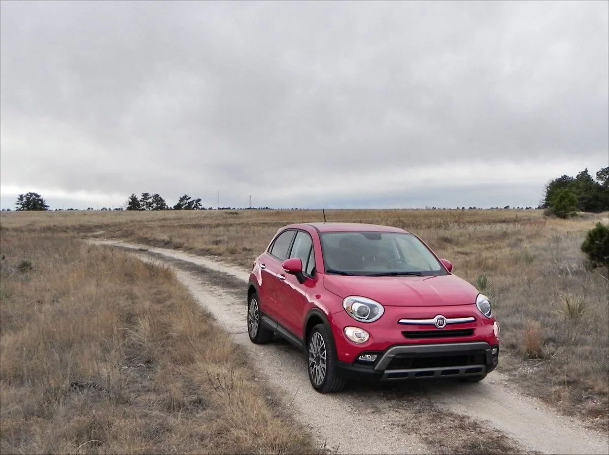 On the outside, the bug-eyed, dimple-mouthed front fascia and short, fast-paced hood are very 500