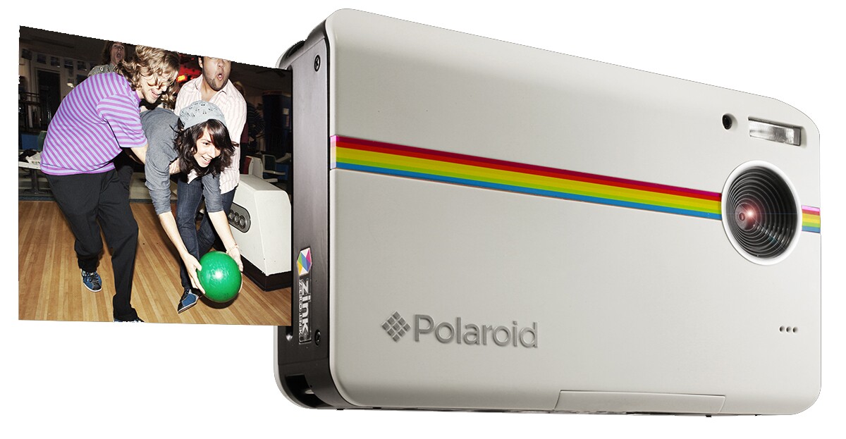 The iPhone is probably one of the best cameras in the world when it comes to sharing your photographs, but it can't print your photos ... the Polaroid Z2300 can.