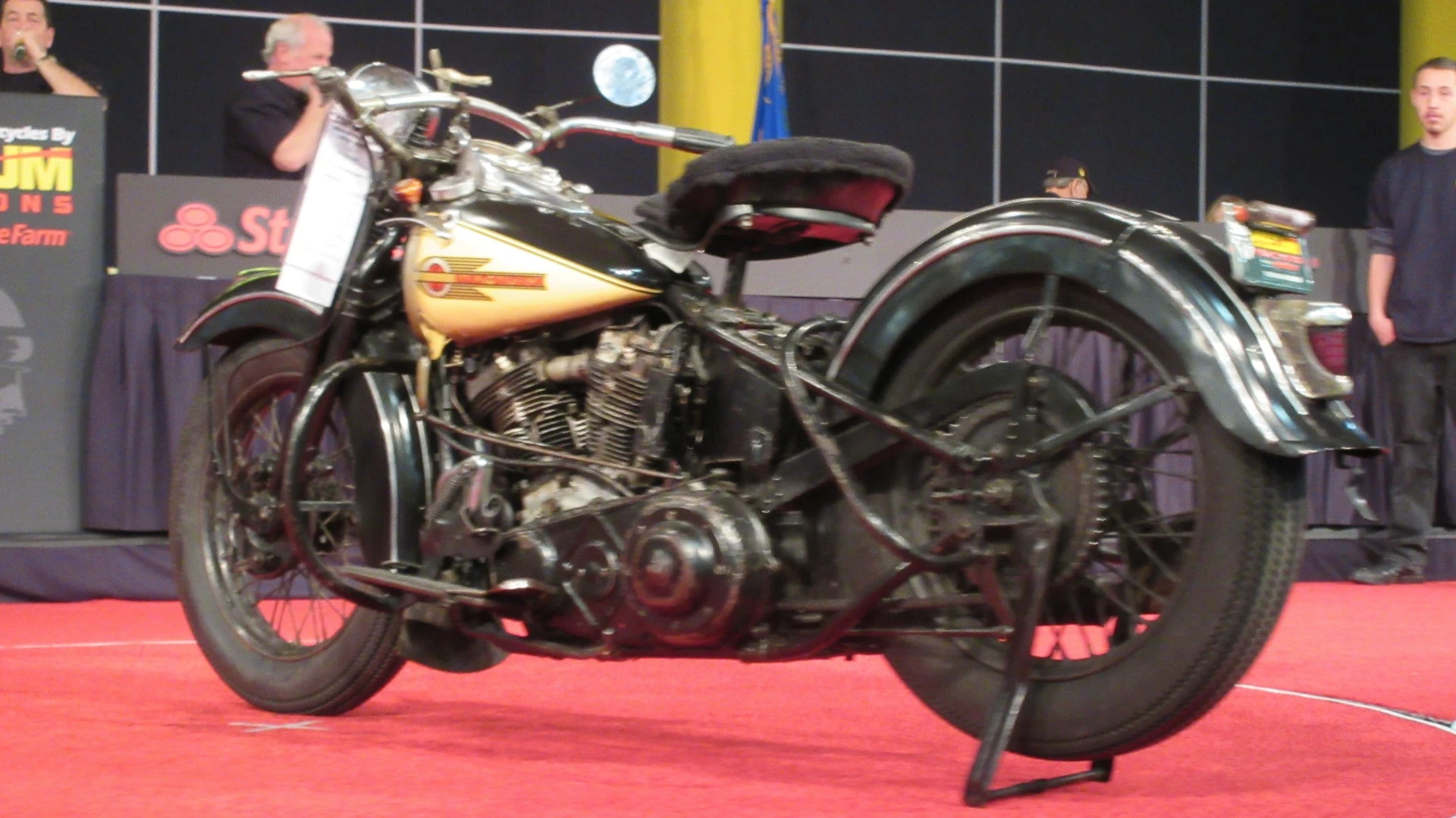 $99,000 – 1939 Harley-Davidson EL Knucklehead - Mecum Lot S65 is a 1939 Harley-Davidson EL Knucklehead, one of the most important American motorcycle models ever produced as it set Harley_Davidson on it's current path of styling. Indeed, the Knucklehead also had a duplex frame, and the first OHV Big Twin from Milwaukee for the street. The record for a Knucklehead at auction is held by a 1936 model which fetched $178,200 in 2014.