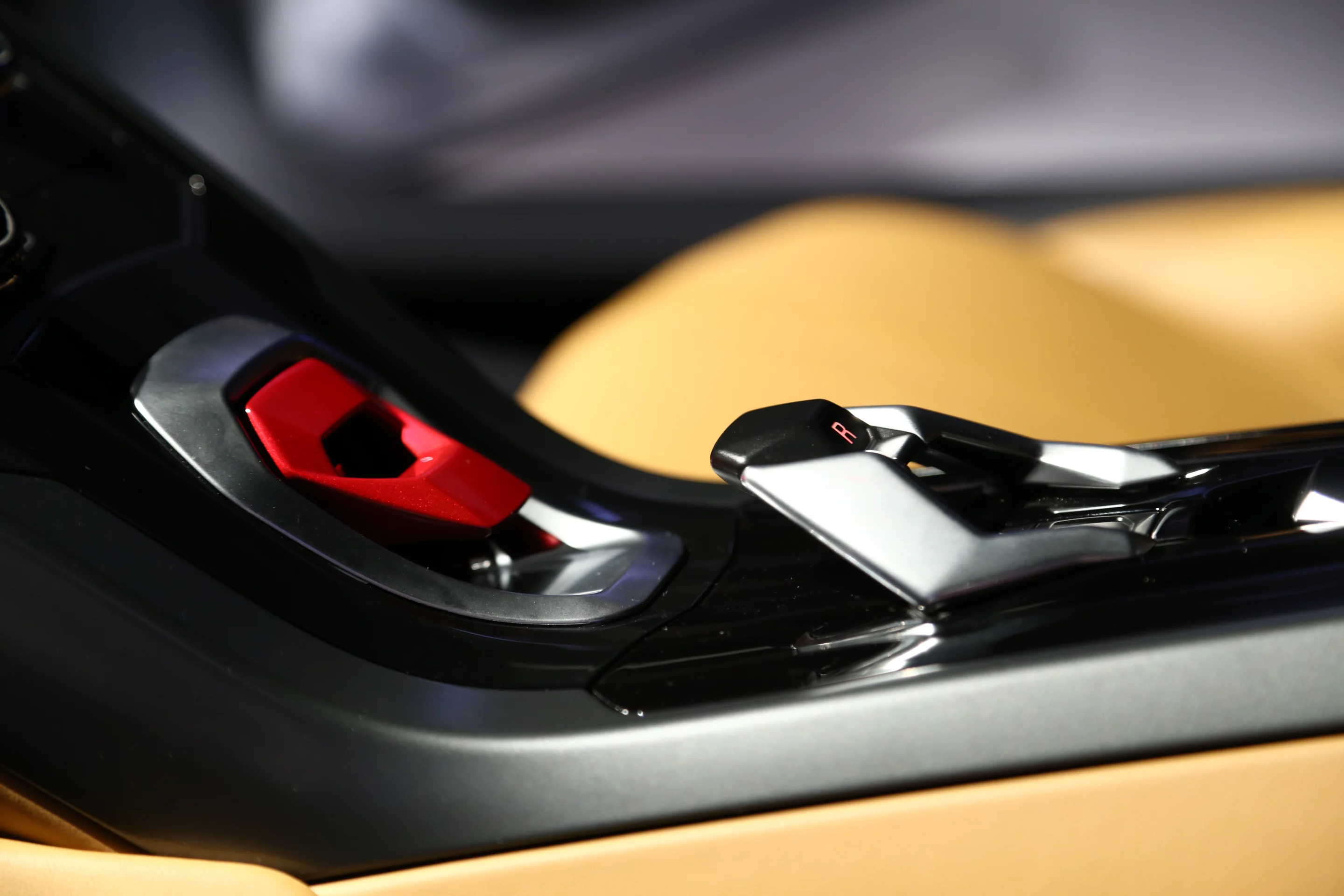 The Huracán features similar interior design elements as the Aventador, like the red fighter cover switch (Photo: Angus MacKenzie/Gizmag.com)