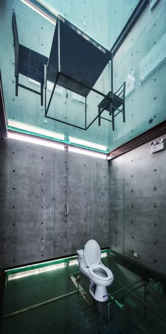 Vertical Glass House doesn't offer much in the way of privacy when taking a bath or going to the toilet
