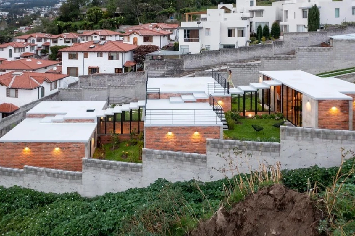 Ecuadorian architectural firm El Sindicato has recently created a unique family home built into a slope