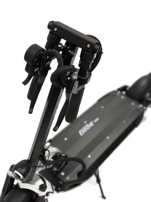 The handlebar of the eMove Cruiser folds in before the stem is folded down for transit