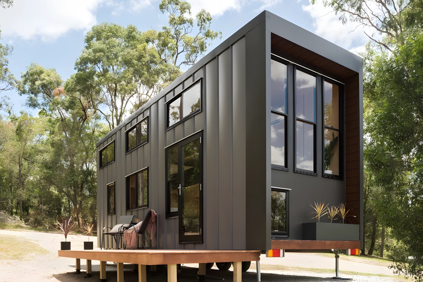 This tiny house has a home office and a netted hangout zone