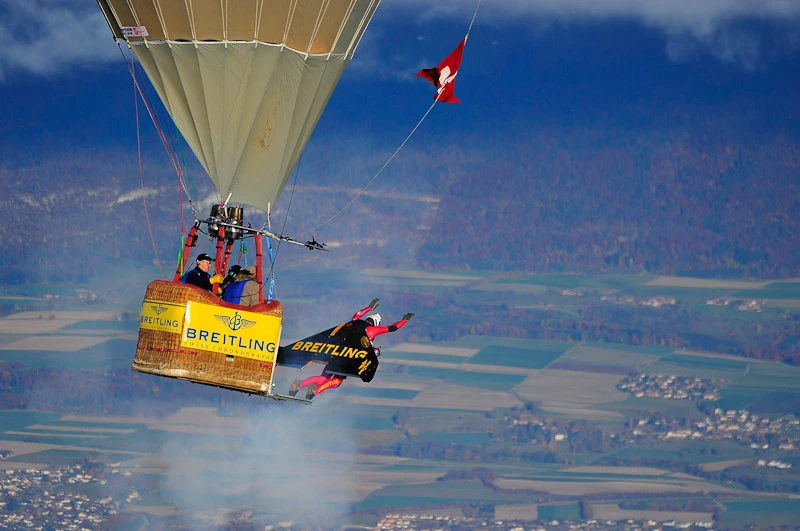 Swiss 'Jetman' Yves Rossy has successfully performed two aerial loops, using his unique strap-on jet-powered wing