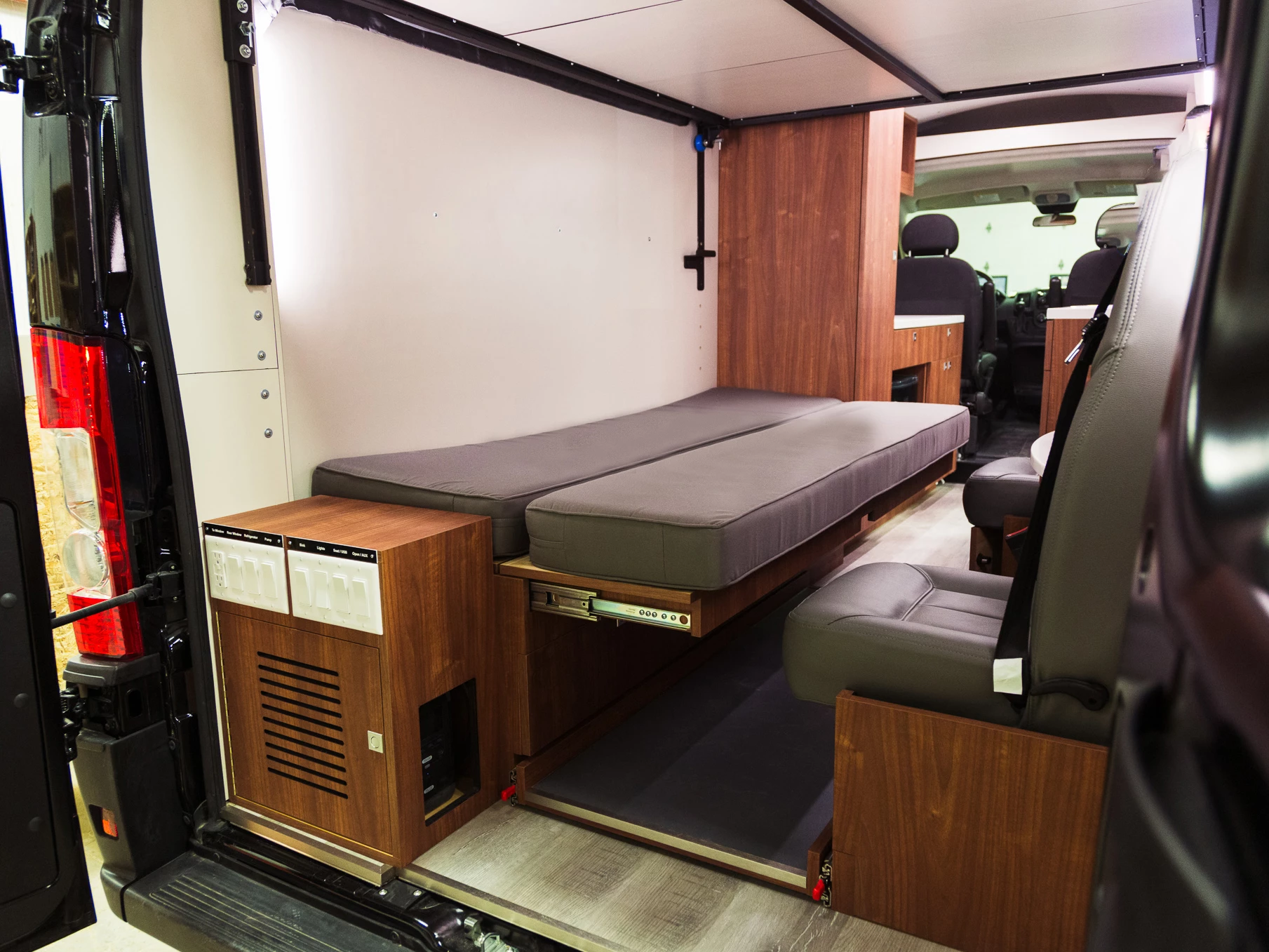 Upper bed lifted and sofa converted into lower bed