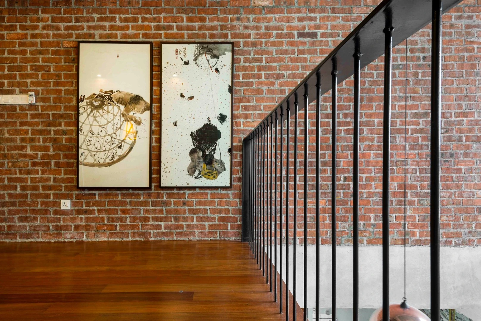 Inside, the home is finished with brick, wood, rough concrete and metal
