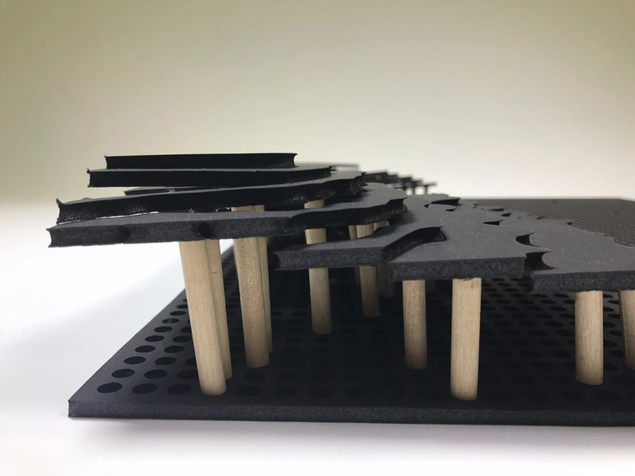 The map sections sit atop wooden dowels