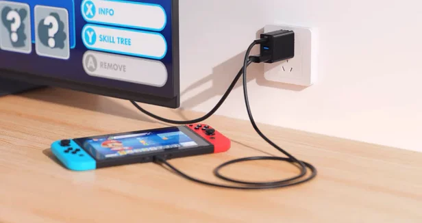The OmniCentro plugs straight into a power socket, charging the Nintendo Switch and passing its output to a display