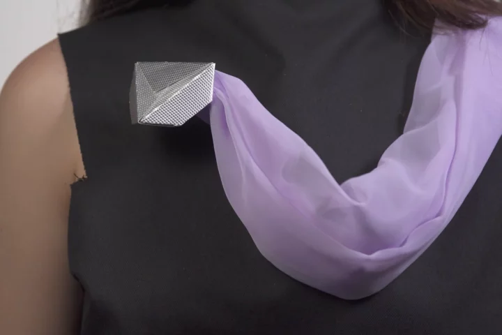 A scarf controlled by mini robots that crawl over clothing