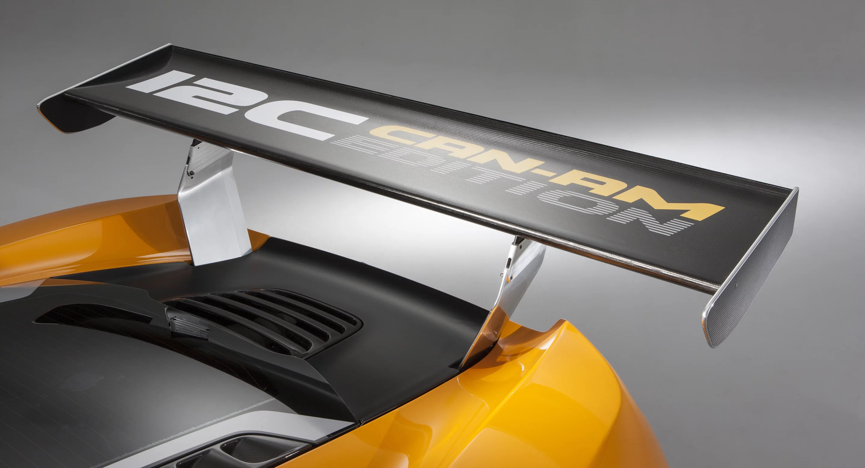 The carbon fiber wing is held in place by polished aluminum mounts