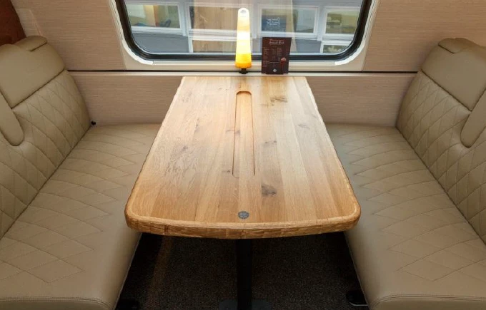 The tables have a groove to keep drinks secure