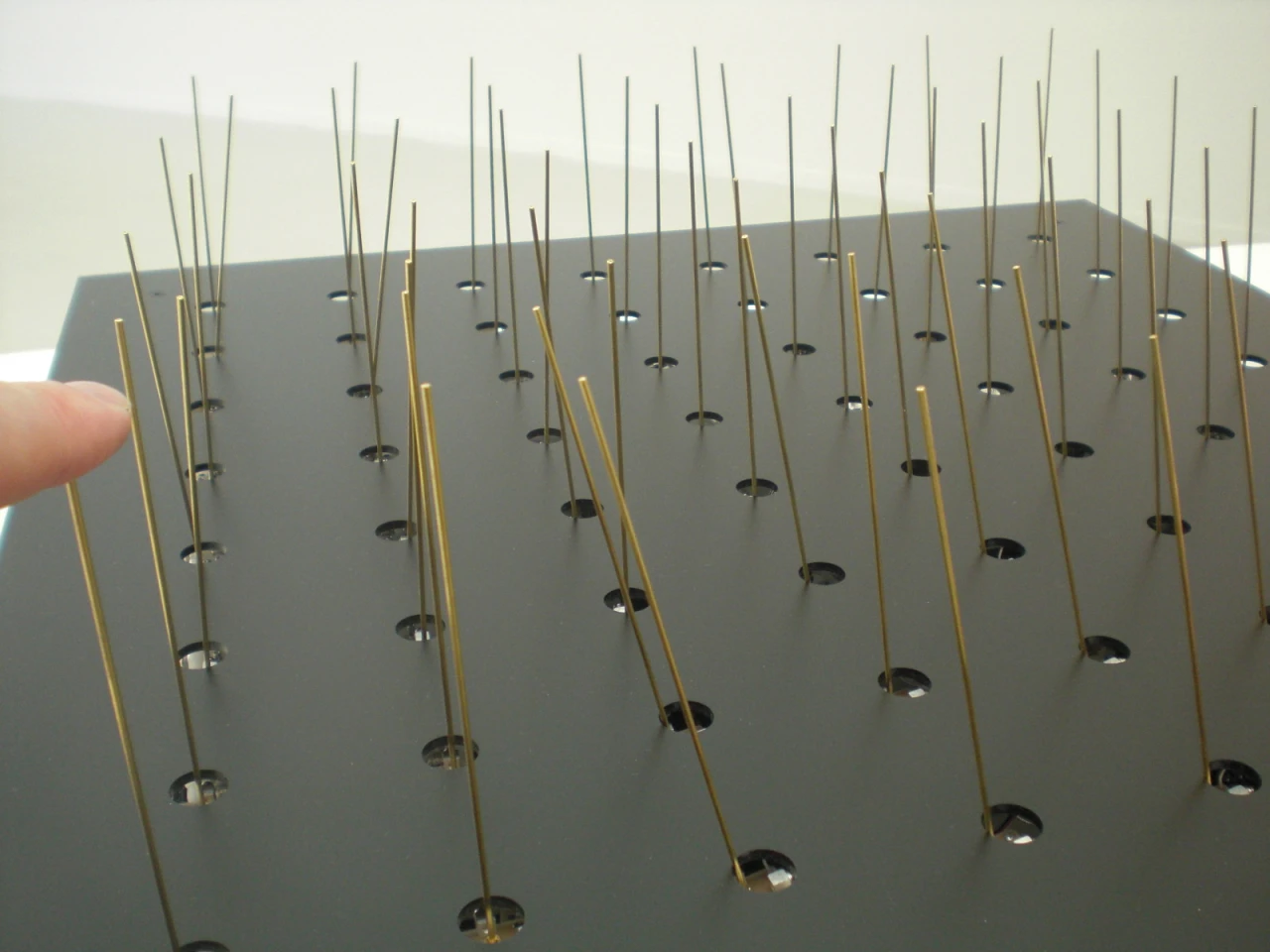 Cilium is a carpet of vertical wires that collectively move towards your finger when you touch one of the tips (Photo: Stephen Clemenger/Gizmag.com)
