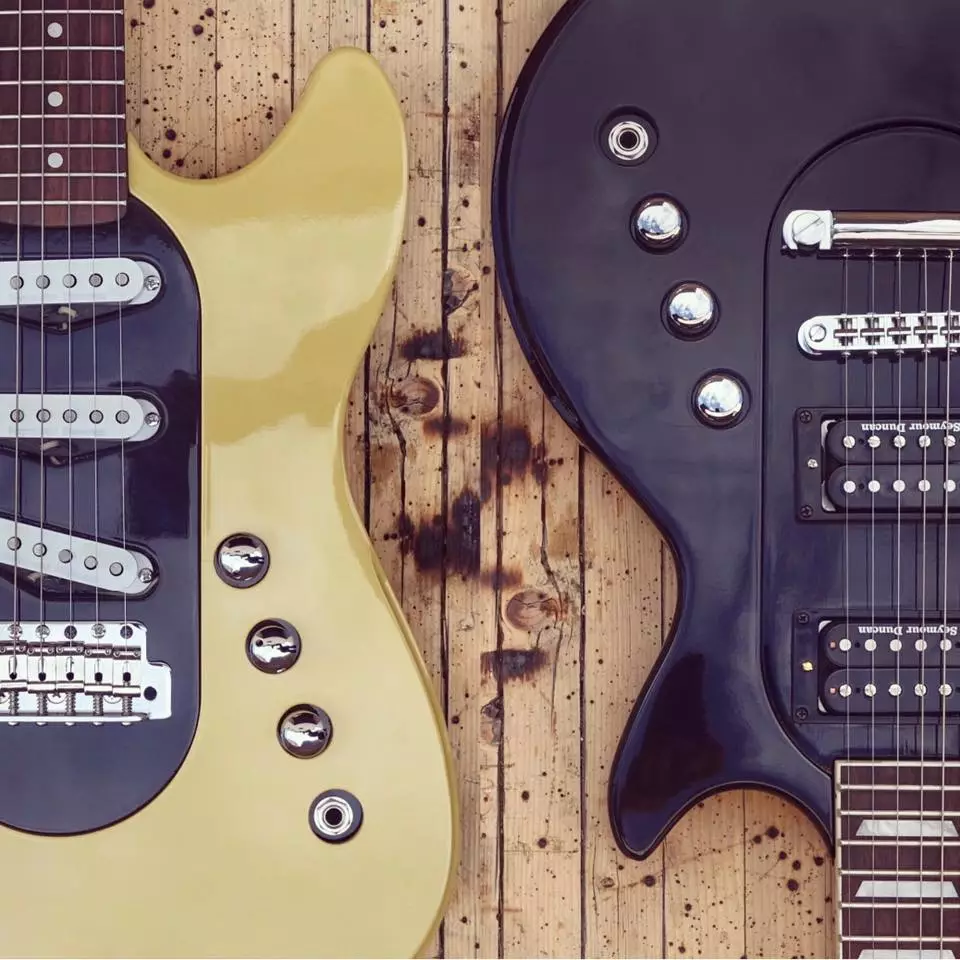 The volume/tone knobs and instrument jack on the core modules pop through the outer body module of the Revolution guitar