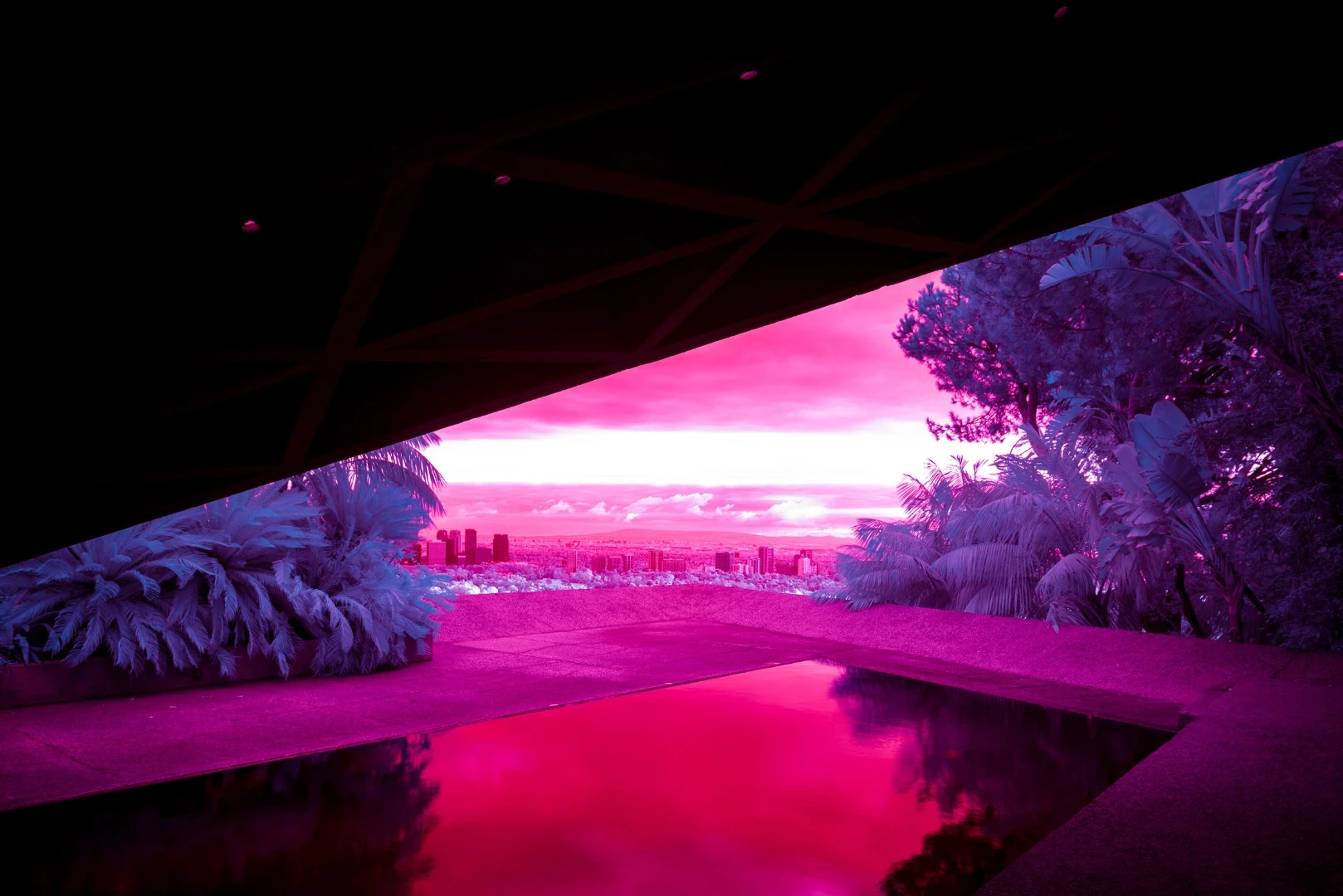 Kate Ballis’ series Infra Realism is an extreme, stylized take on the style contrasting images of classic mid-century Palm Springs architecture with jarringly sharp and disorientating infrared purples and reds
