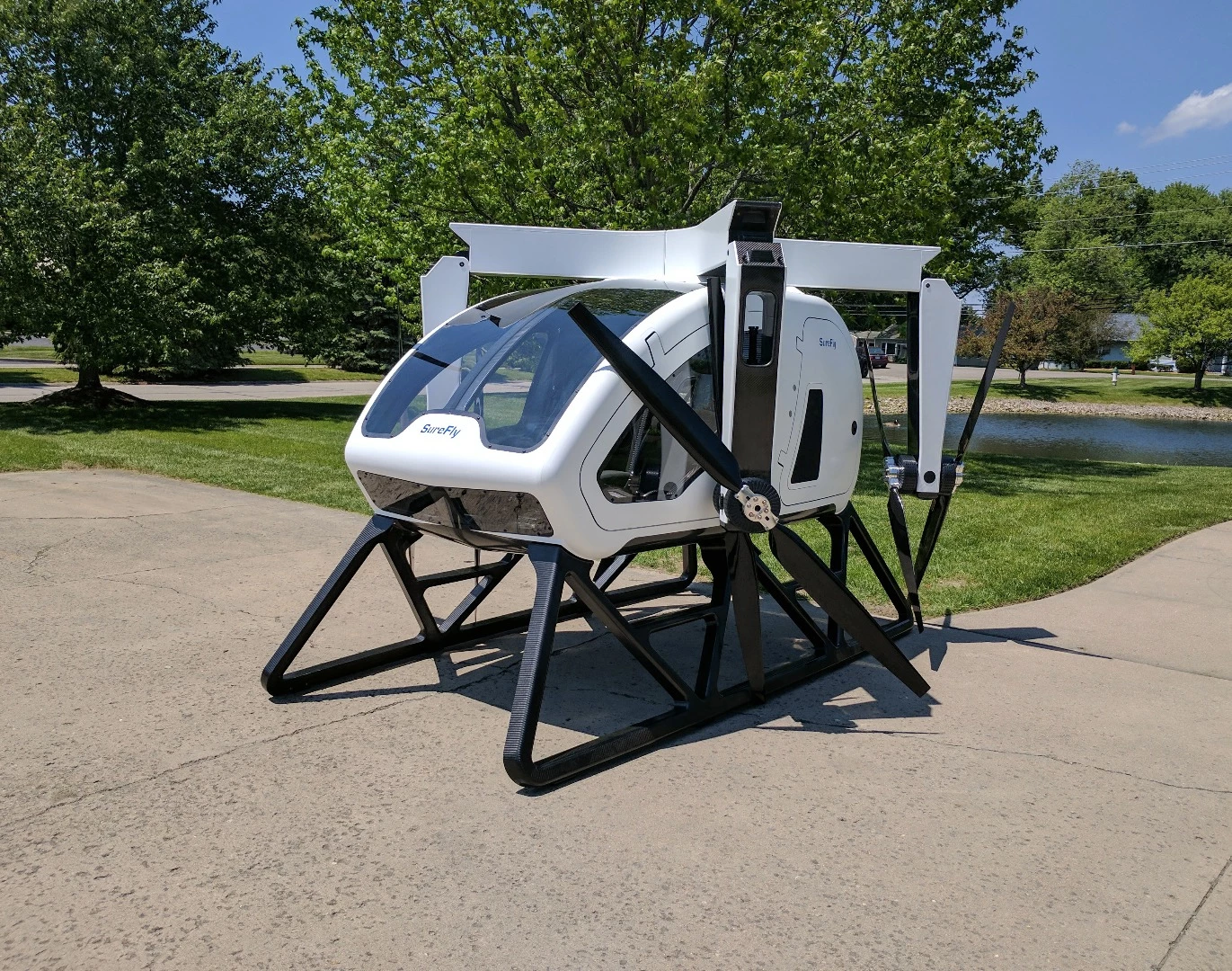 The 1,100 kg Workhorse Surefly uses an electric quadcopter layout with two contra-rotating propellers on each corner and a range-extending petrol engine, giving it a range of 70 miles and a top speed of 70 mph.
