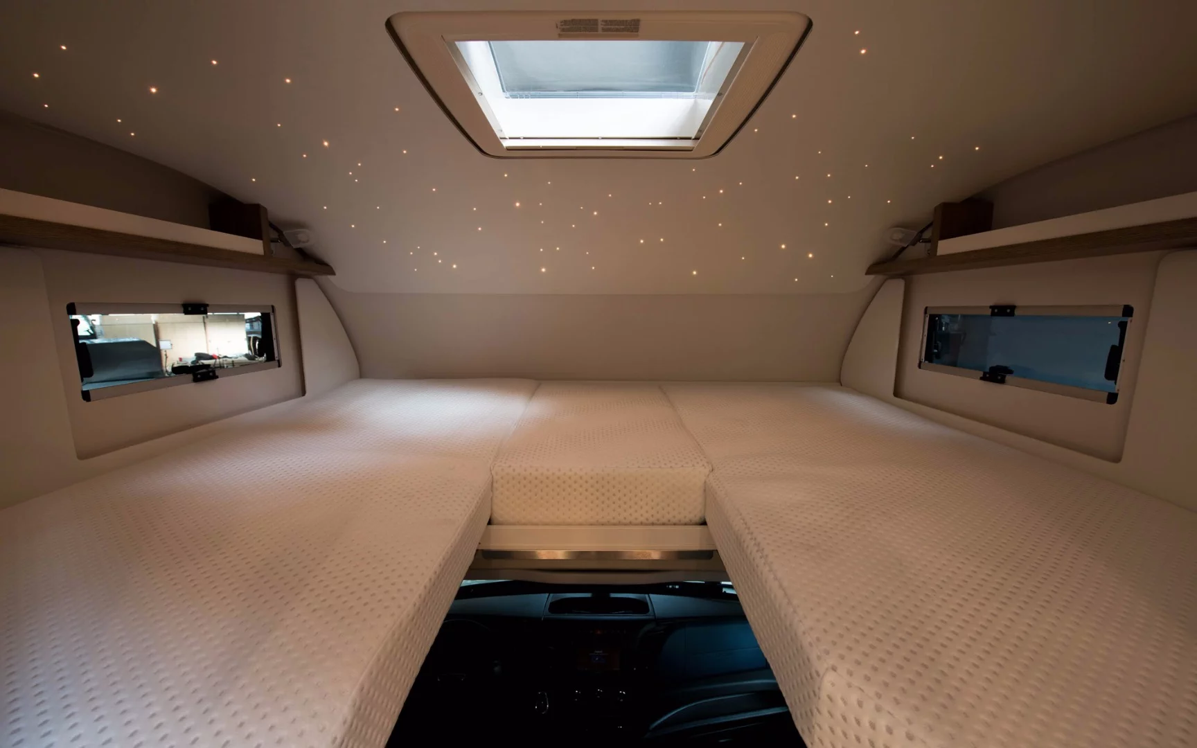 The alcove bed area includes a starlight projection system