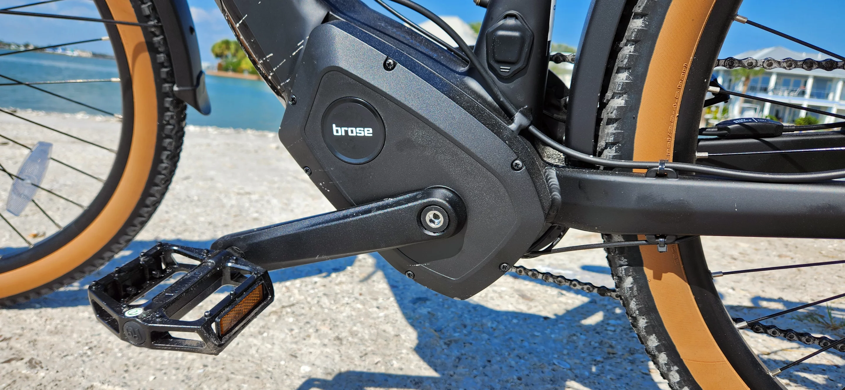 The bike is okay to ride in the rain with an IP65 rating, but don't go fording rivers with it and don't pressure wash it