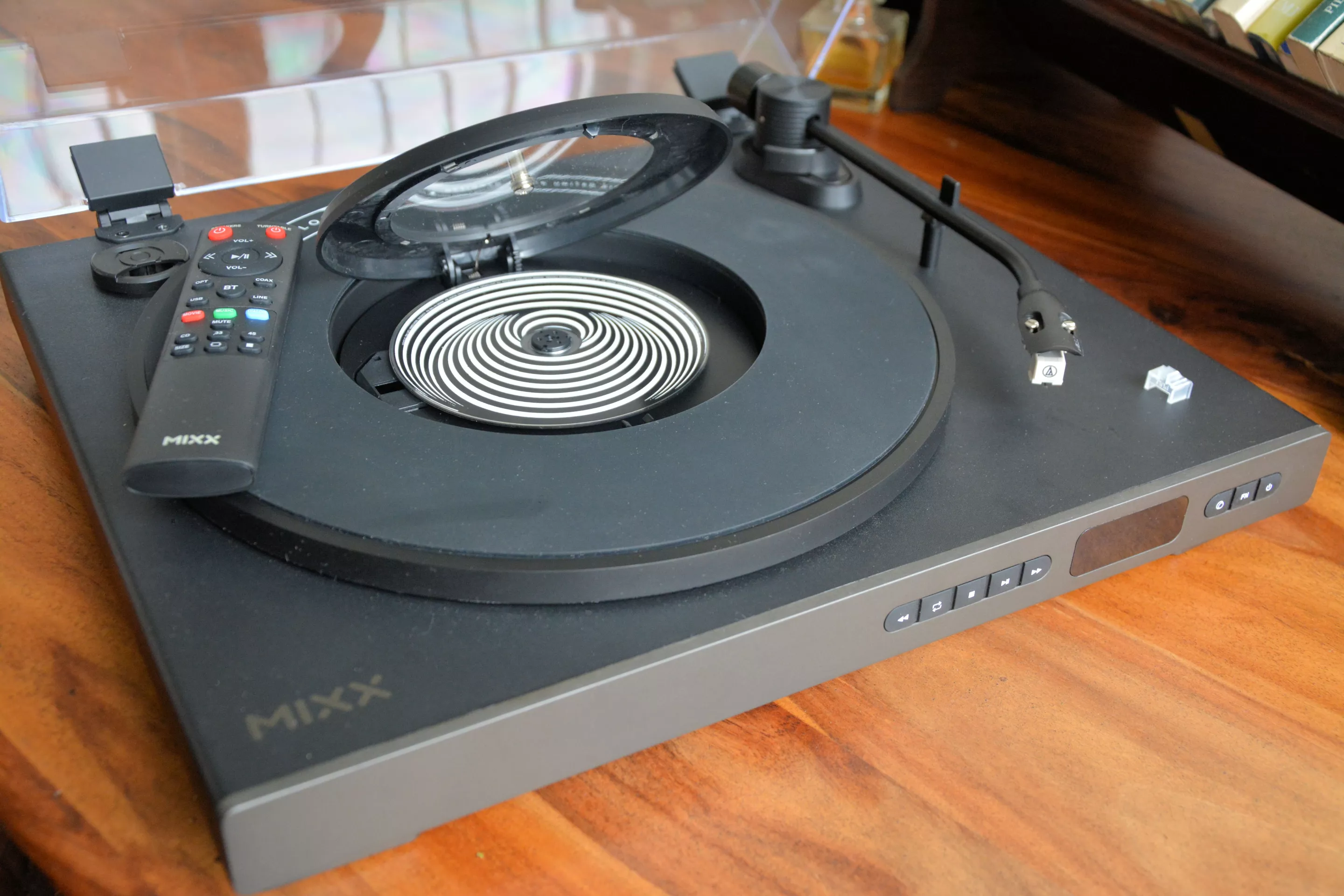 Pop the lid, load in a CD, power on and play through a portable Bluetooth speaker