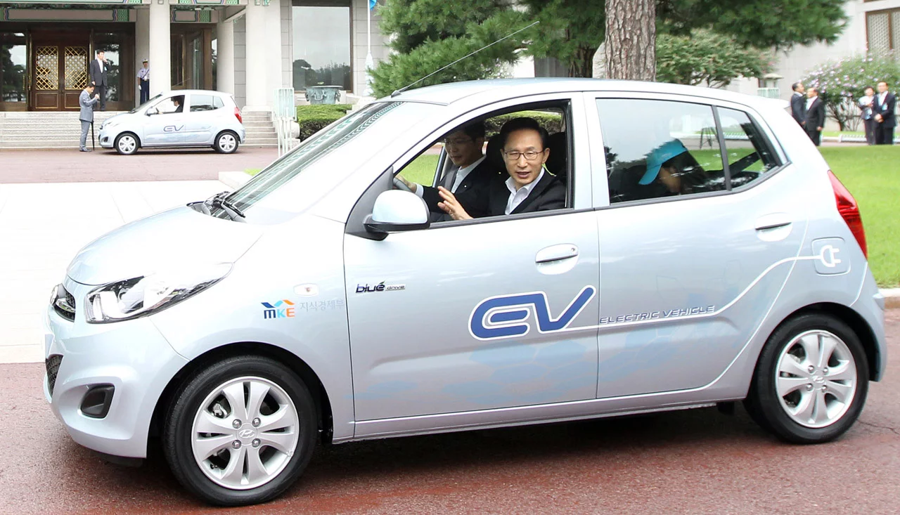 South Korean President Lee Myung-Bak takes Hyundai's BlueOn for a spin during the unveiling ceremony