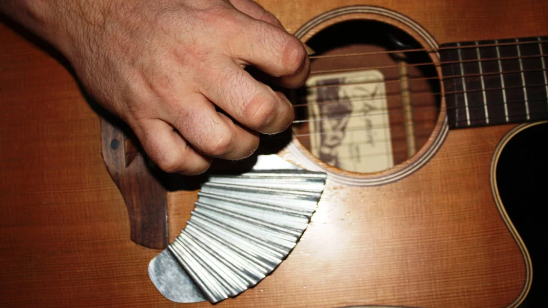 When attached below the picking area of an acoustic guitar, the Pik'N Board offers players the means to provide their own strum-stroke back beat