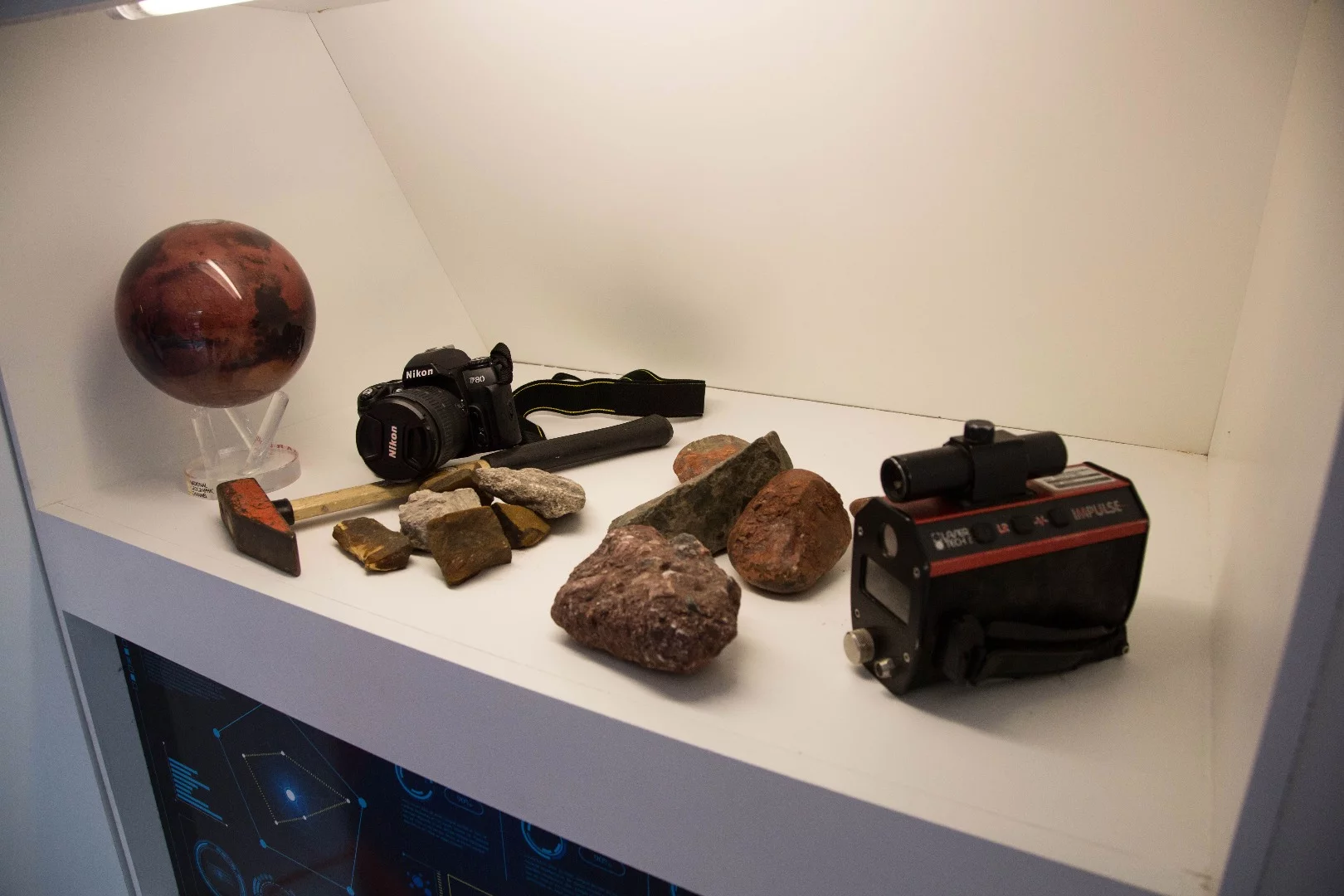 Various knick-knacks are scattered around the shelves of the Mars show home