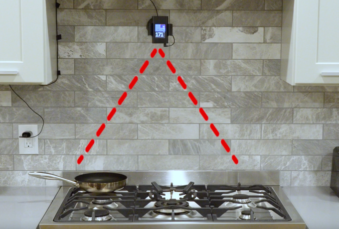 PanPerfect is mounted on the wall behind the oven