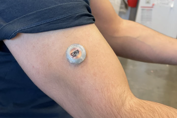 The prototype device is described as being "about the size of a stack of six quarters"