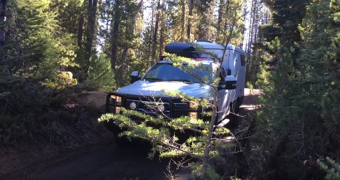The EarthCruiser EXD works its way through the forest