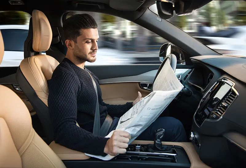 Will cars ever be smart enough that we can read the paper instead of the road while we're driving?