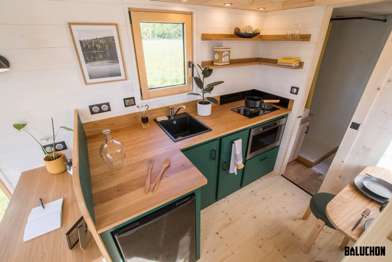 The Midgard's kitchen connects to the bathroom via a sliding door