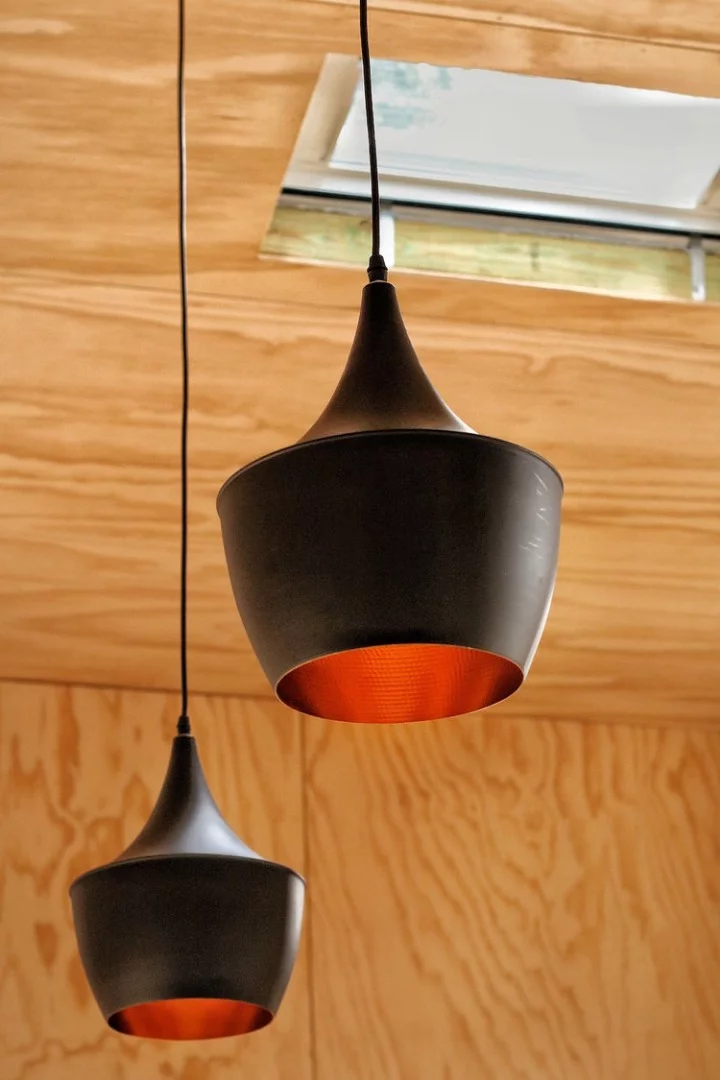 Simple hanging lamps add a sophisticated touch to the Sowelo tiny home