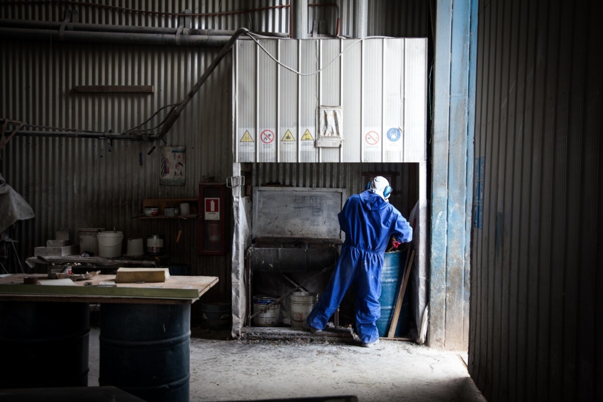 A worker at Wopper's boatyard in Valdivia, Chile