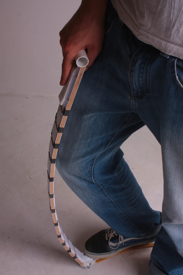 The vertical part of the Belt Scooter comprises a segmented design which stiffens when required