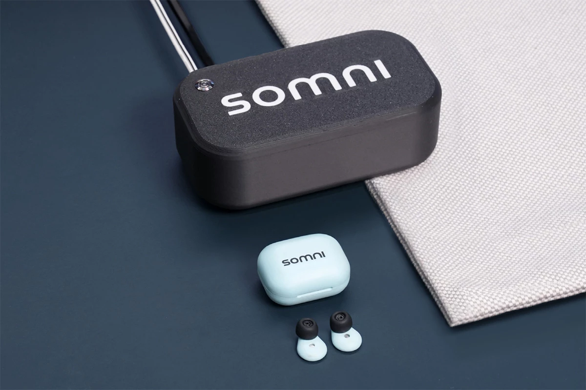 The SomniBuds kit includes a pair of battery-less buds, a power brick and Bluetooth receiver, and a mat that goes under your pillow or bedsheet