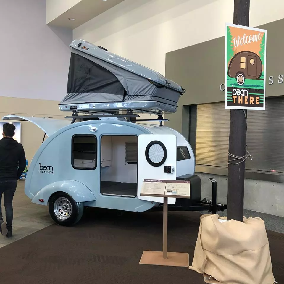 Bean shows its trailer with roof rails and hardshell roof-top tent at the 2018 Utah RV show